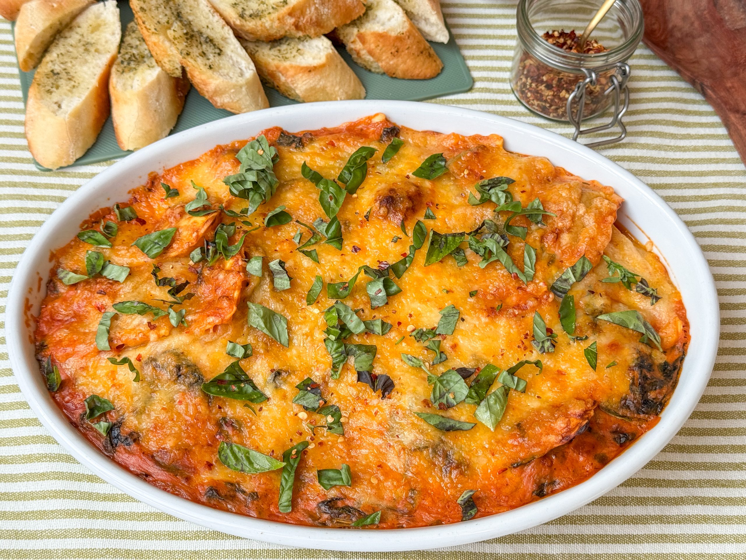 makkelijke recepten september - ravioli ovenschotel met spinazie in romige tomatensaus